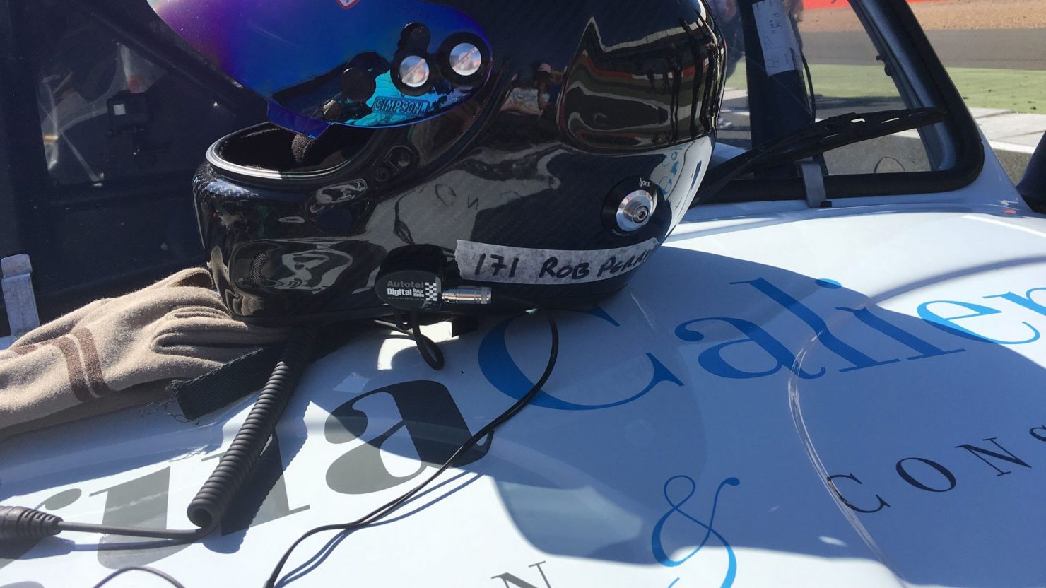 vehicle graphics of logo design and race team helmet for agua caliente